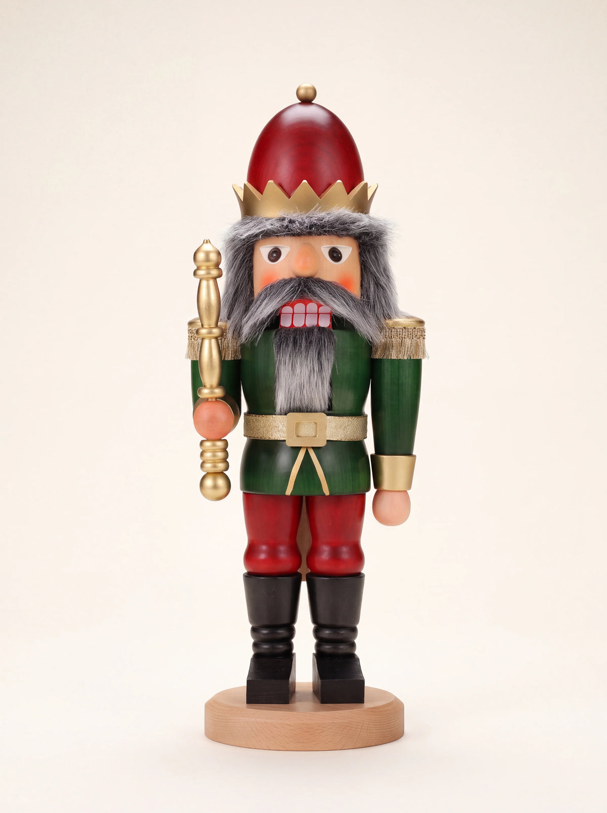Wooden king nutcracker painted in red and green with a golden crown, sceptre and grey faux-fur beard