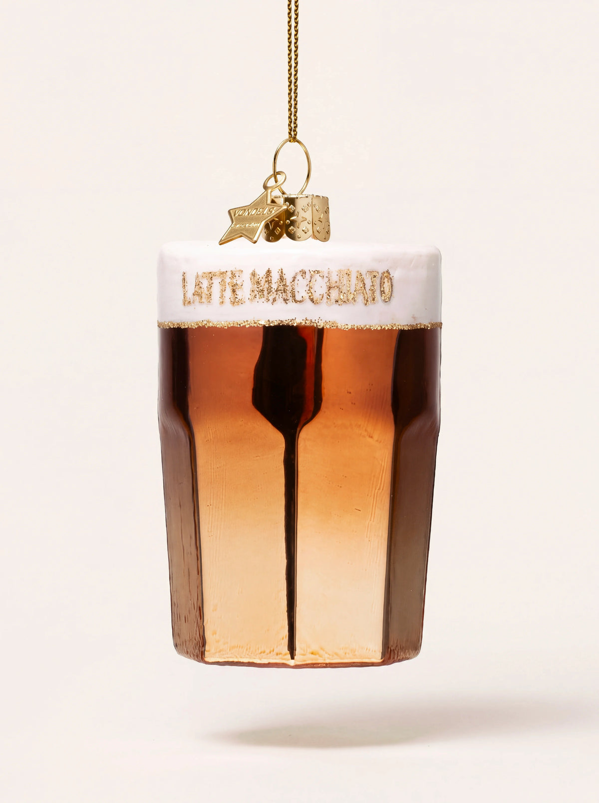 Glass latte macchiato ornament with white foam, coffee tones and gold glitter lettering reading LATTE MACCHIATO
