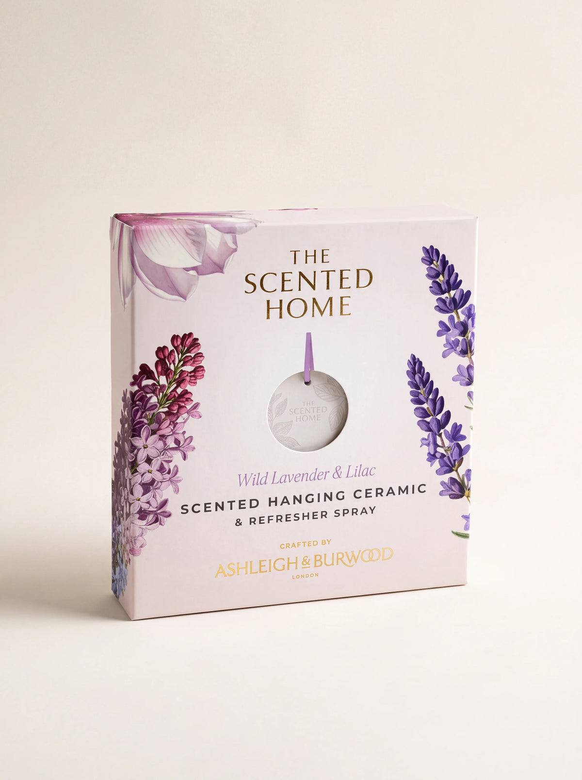 Packaging box featuring lavender and lilac illustrations with a round window showing the disc inside