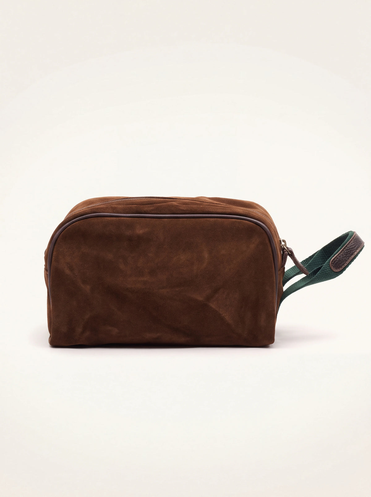 Tobacco brown suede beauty case with dark brown piping and a green loop handle
