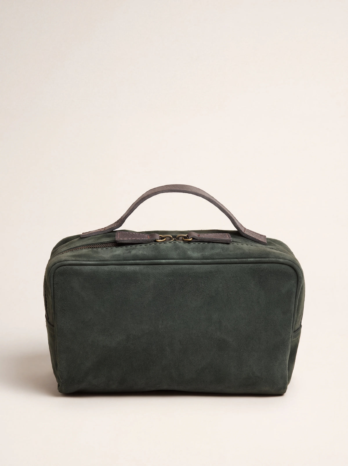 Rectangular dark green suede beauty case with top leather handle and two-way zip closure