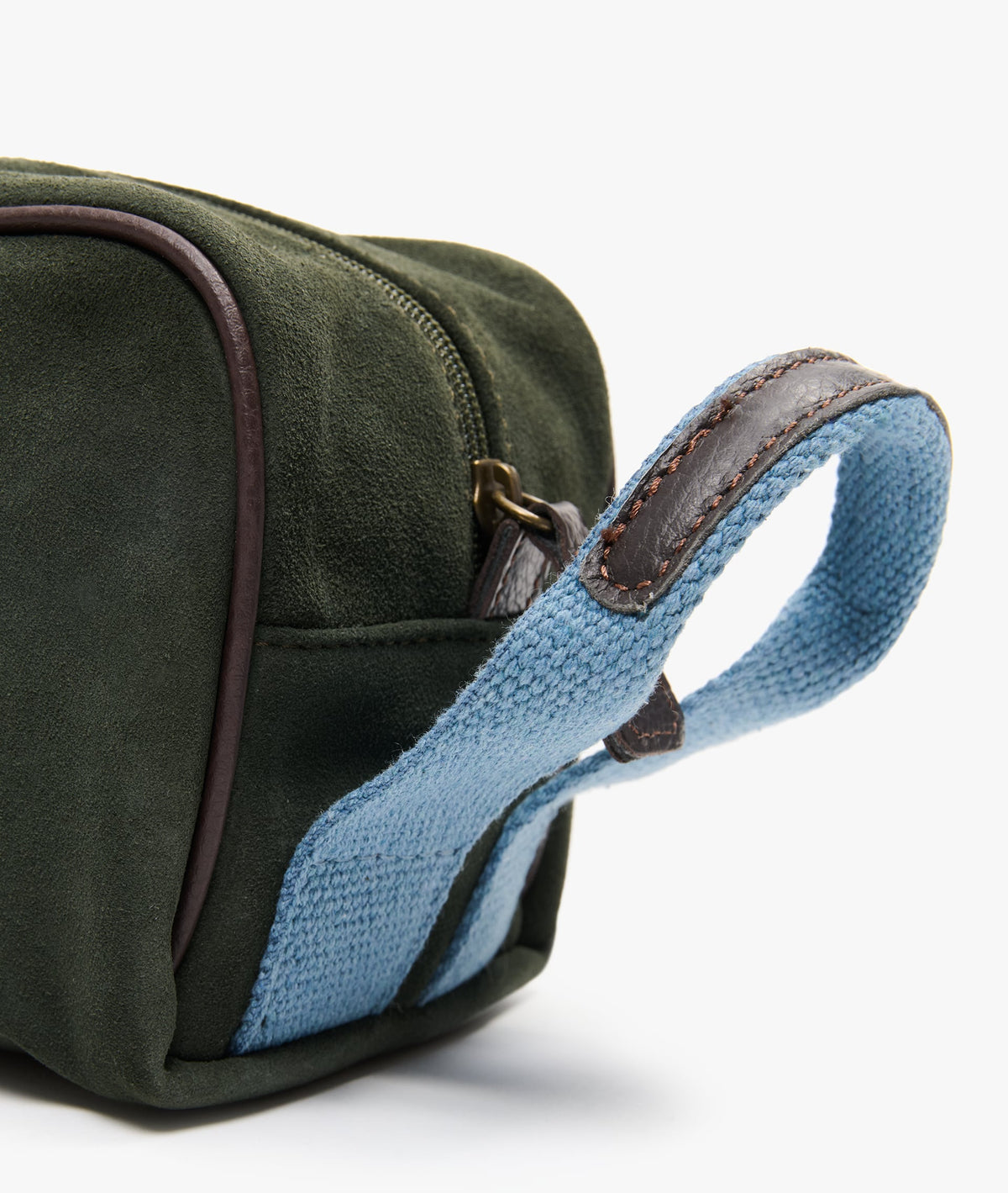 Close-up of the light blue woven handle with stitched brown leather trim and metal zip pull