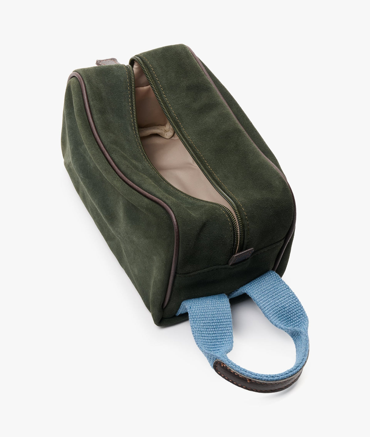 Dark green suede toiletry bag unzipped from above to reveal the light fabric lining