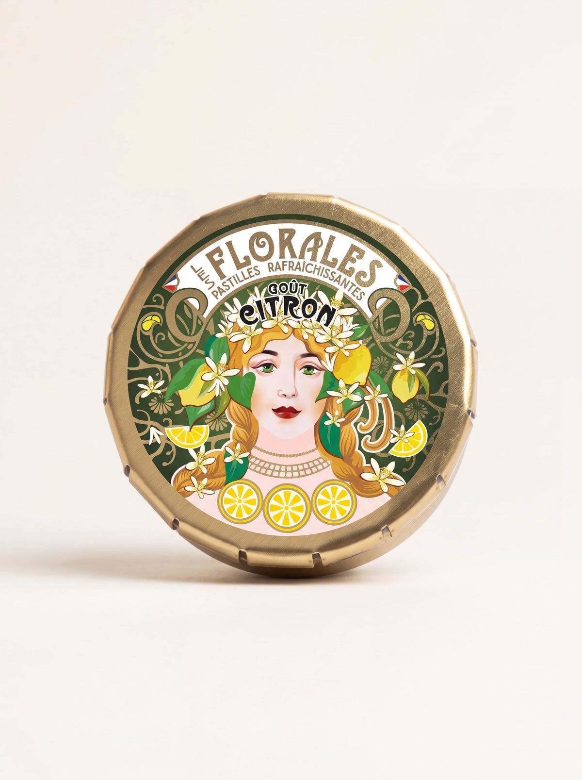 Gold-coloured metal tin with an illustrated lid reading LES FLORALES PASTILLES RAFRAÎCHISSANTES GOÛT CITRON