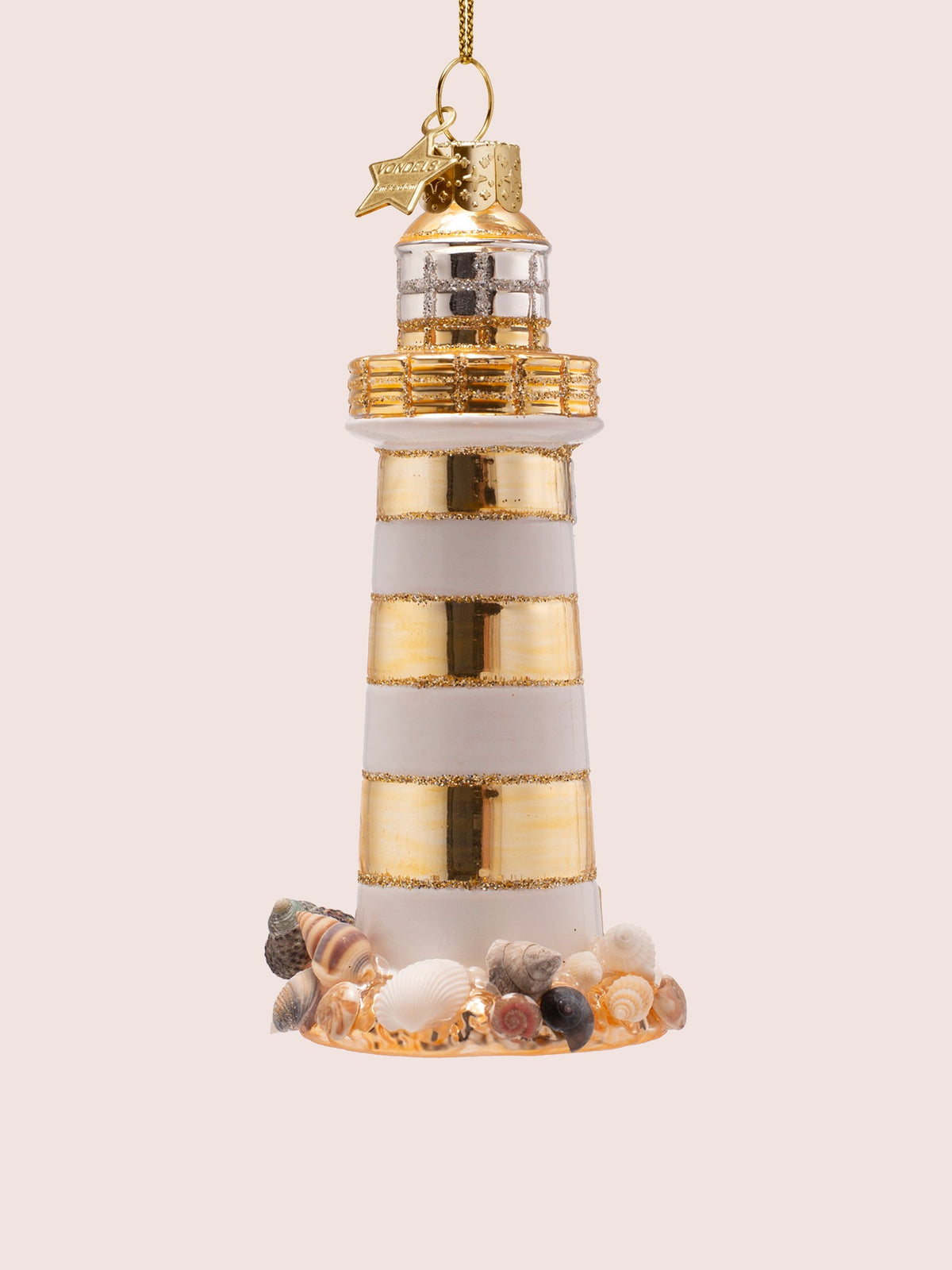 Rear view showing the striped tower and a variety of miniature seashells along the base