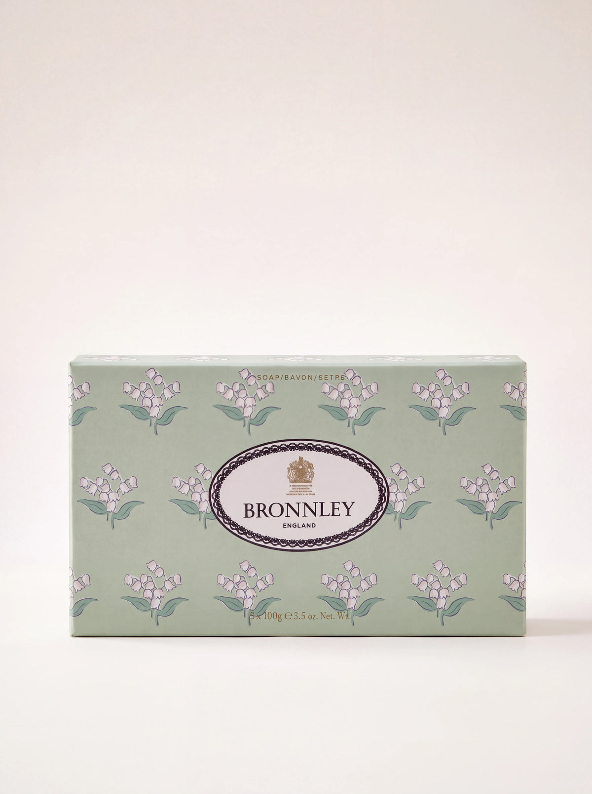 Box of three lily of the valley soaps in pale green packaging with floral illustrations