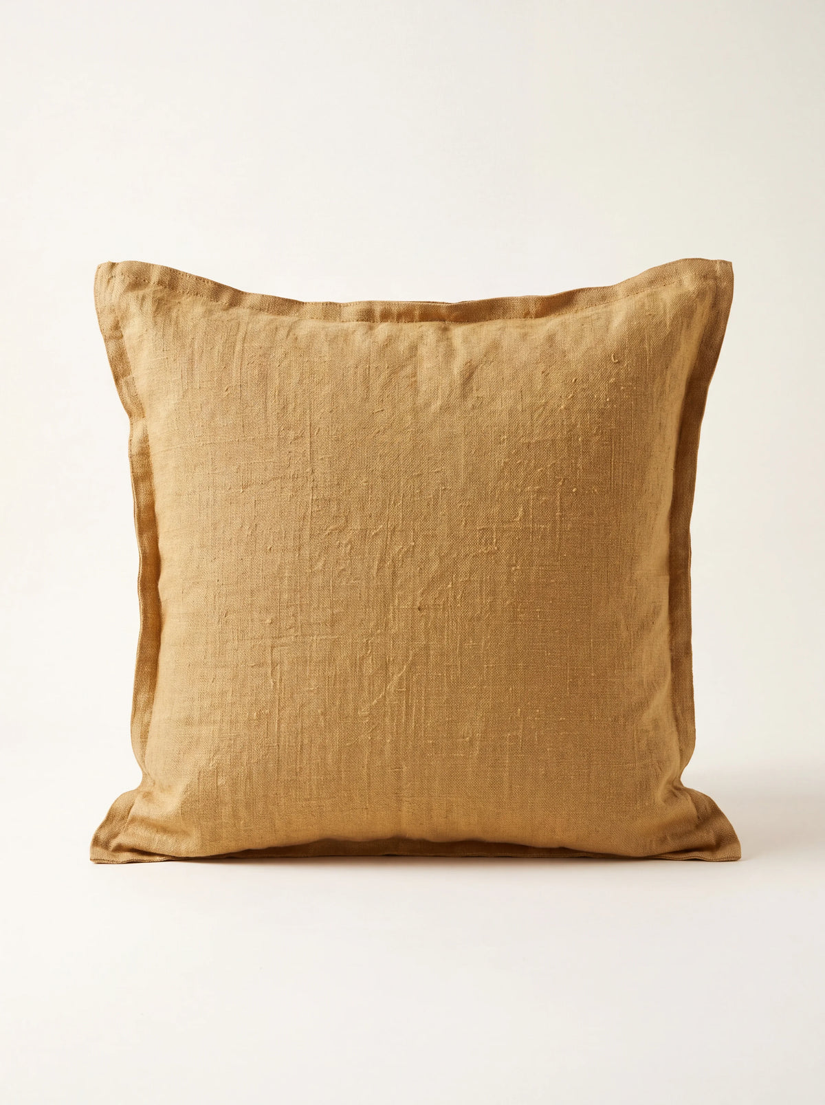 Square butternut yellow linen cushion with a double flange border