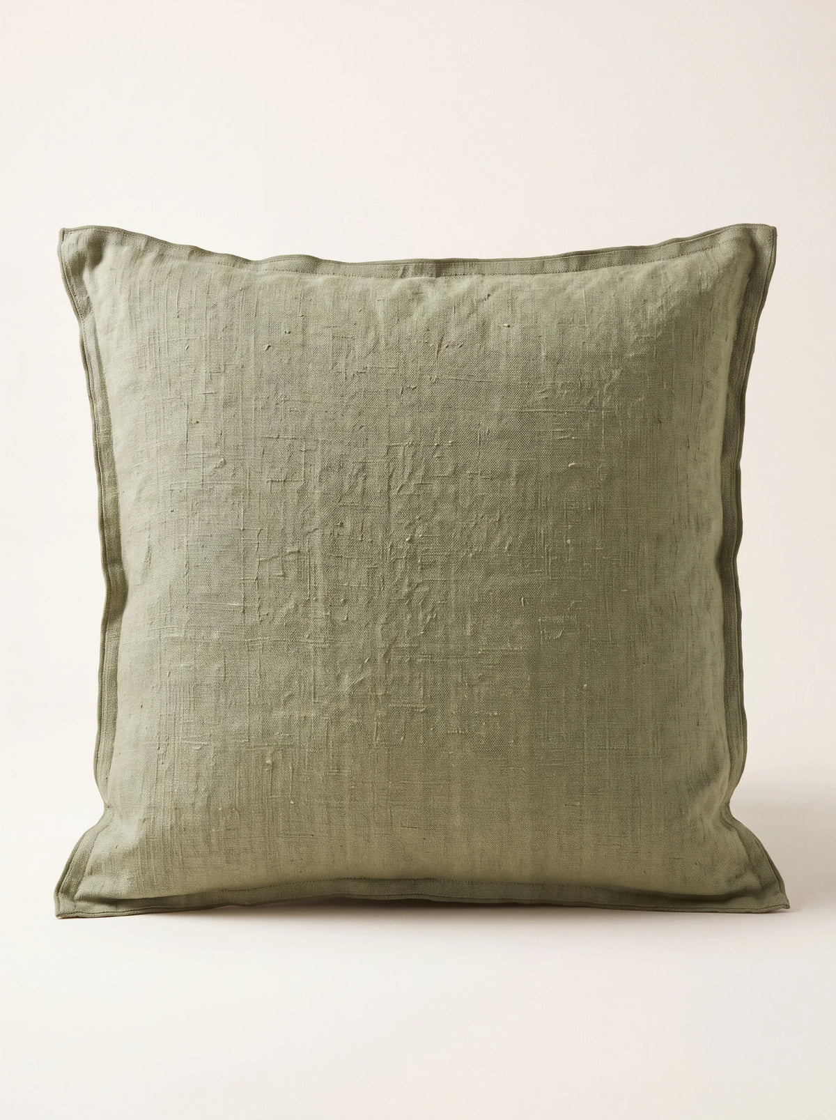 Celery green stonewashed linen cushion with a double-flange border