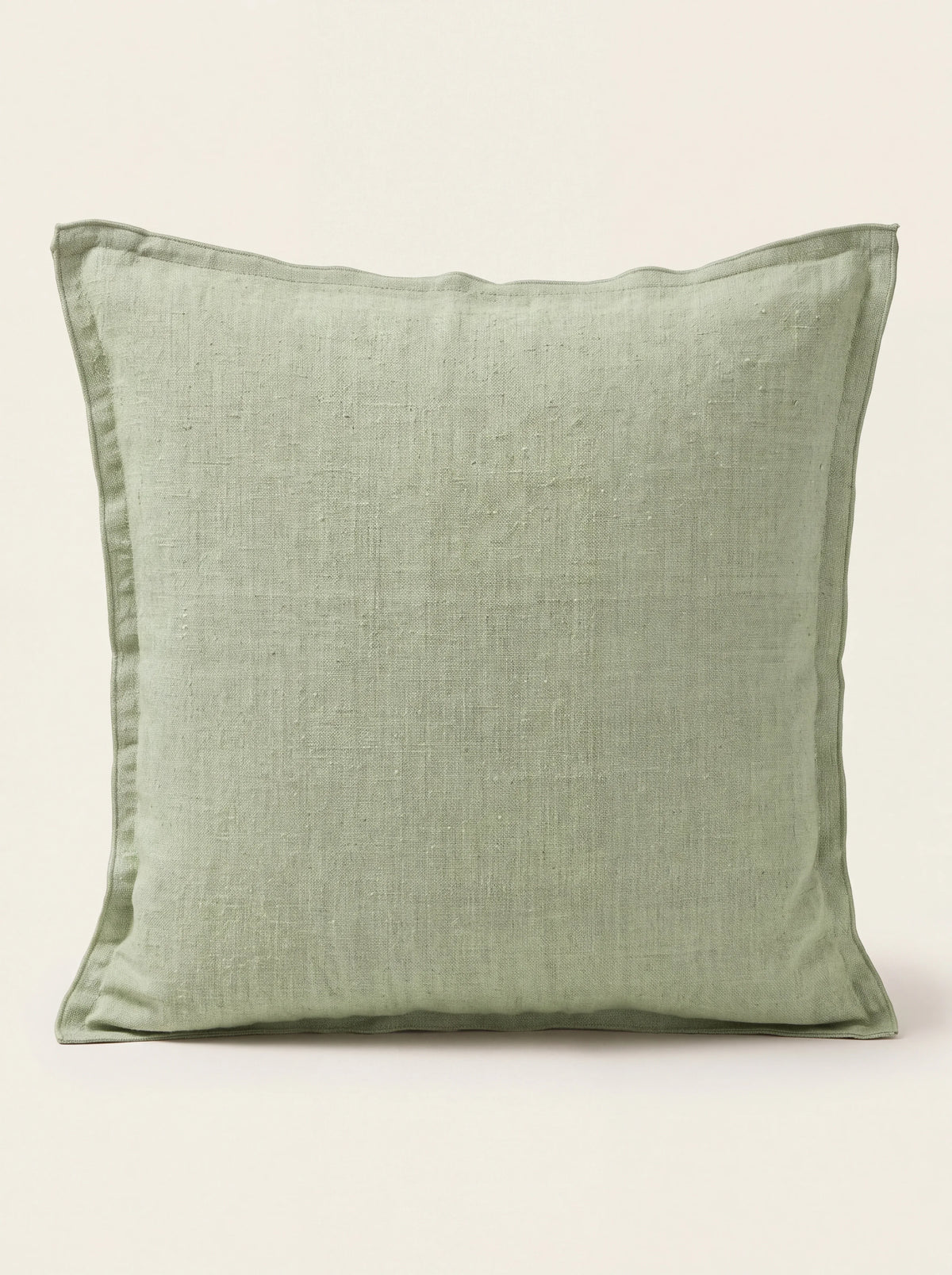 Square laurel green stonewashed linen cushion with a double flange border