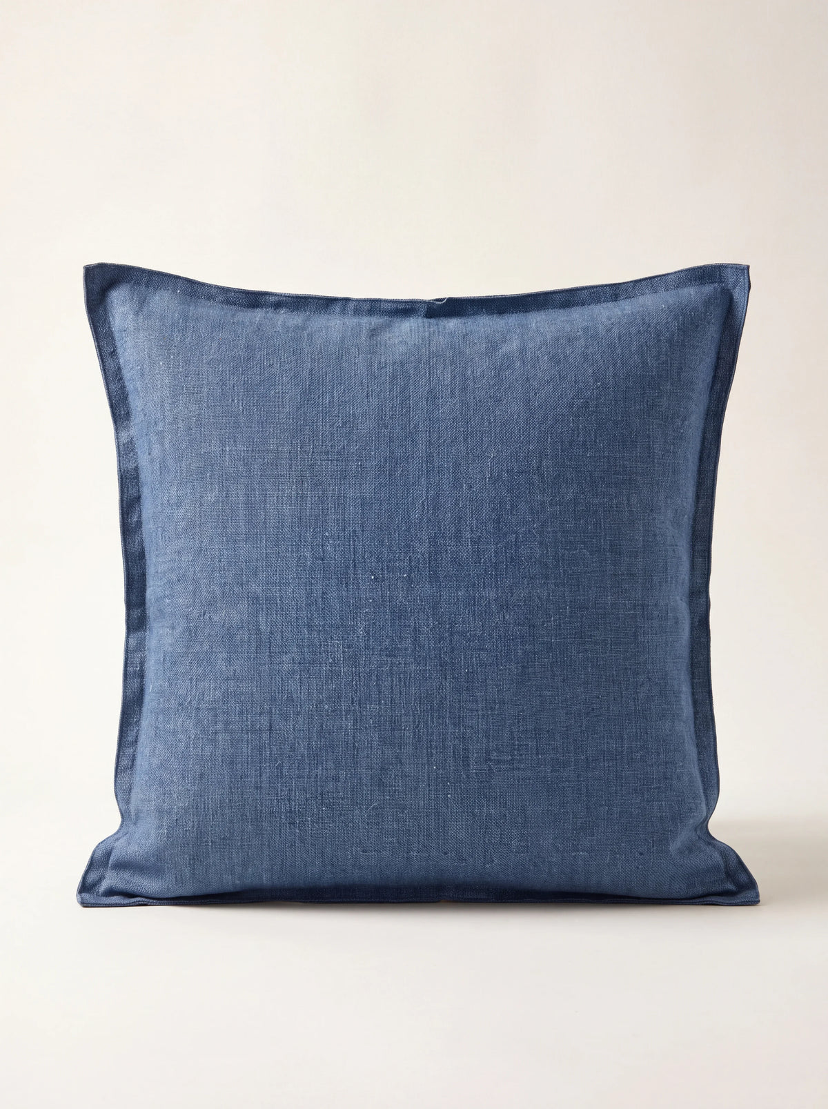 Blue stonewashed linen cushion with a double flange border