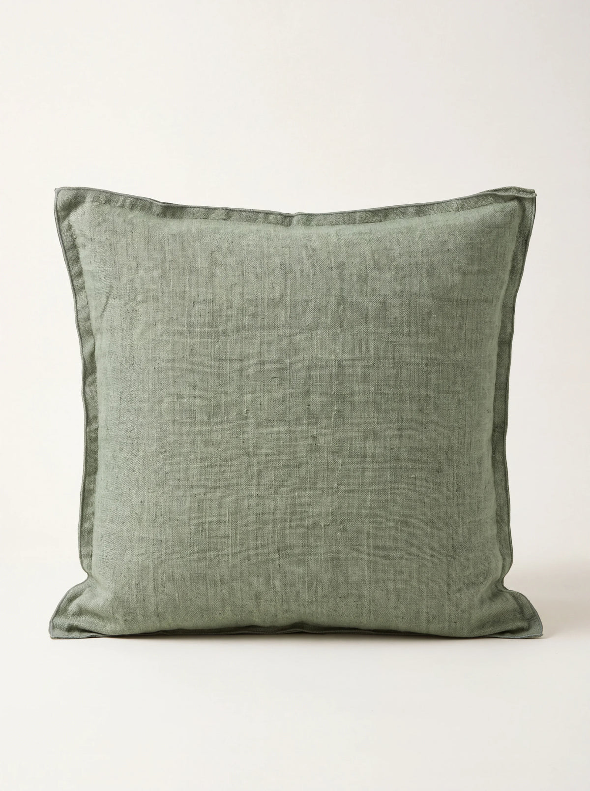 Square seagrass green stonewashed linen cushion with a double flange border
