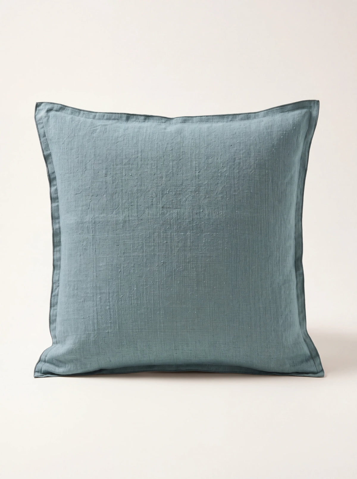 Square tourmaline blue stonewashed linen cushion with a double-flanged border