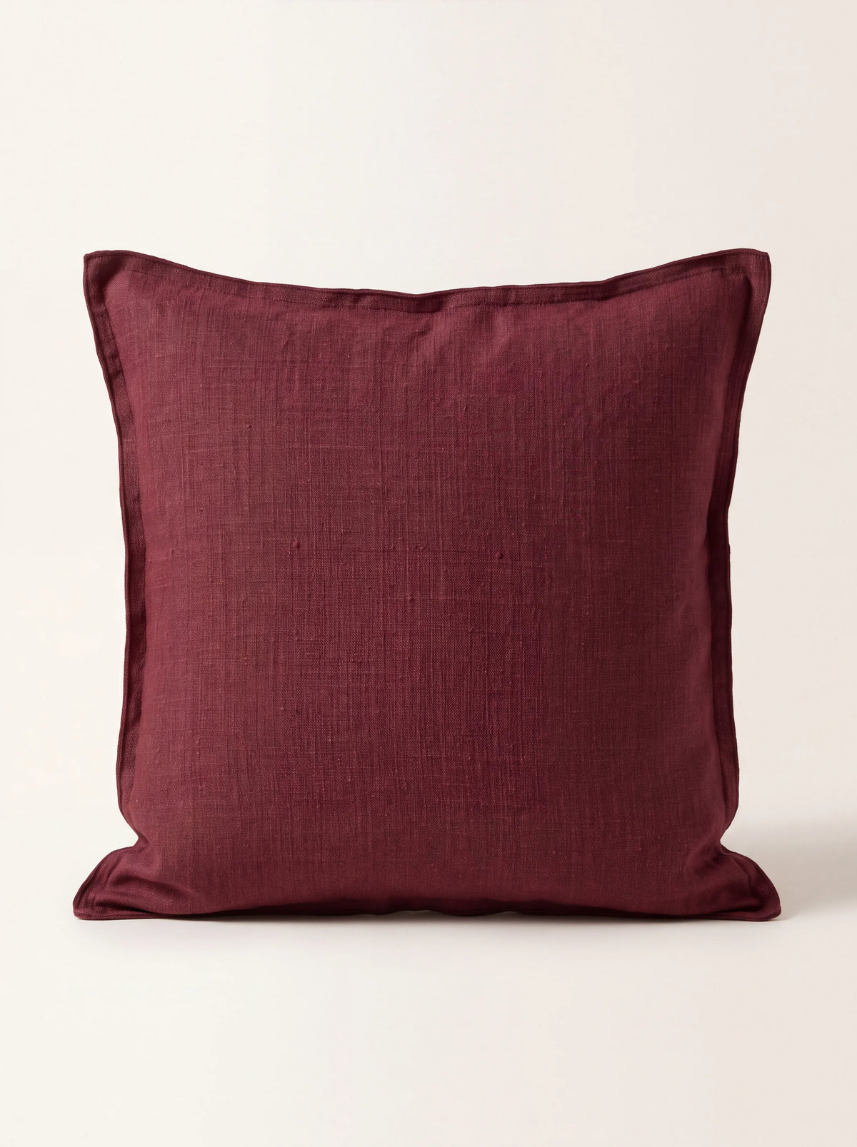 Square wine-red stonewashed linen cushion with a double flange border