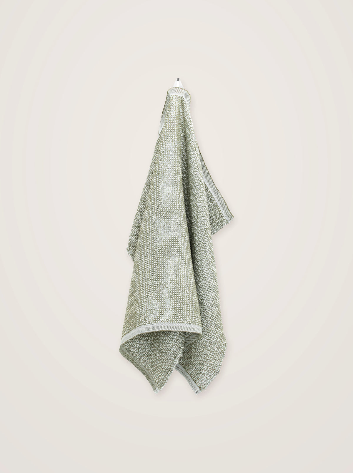 Linen-blend towel in olive green and white, showing the textured waffle weave and finished hem