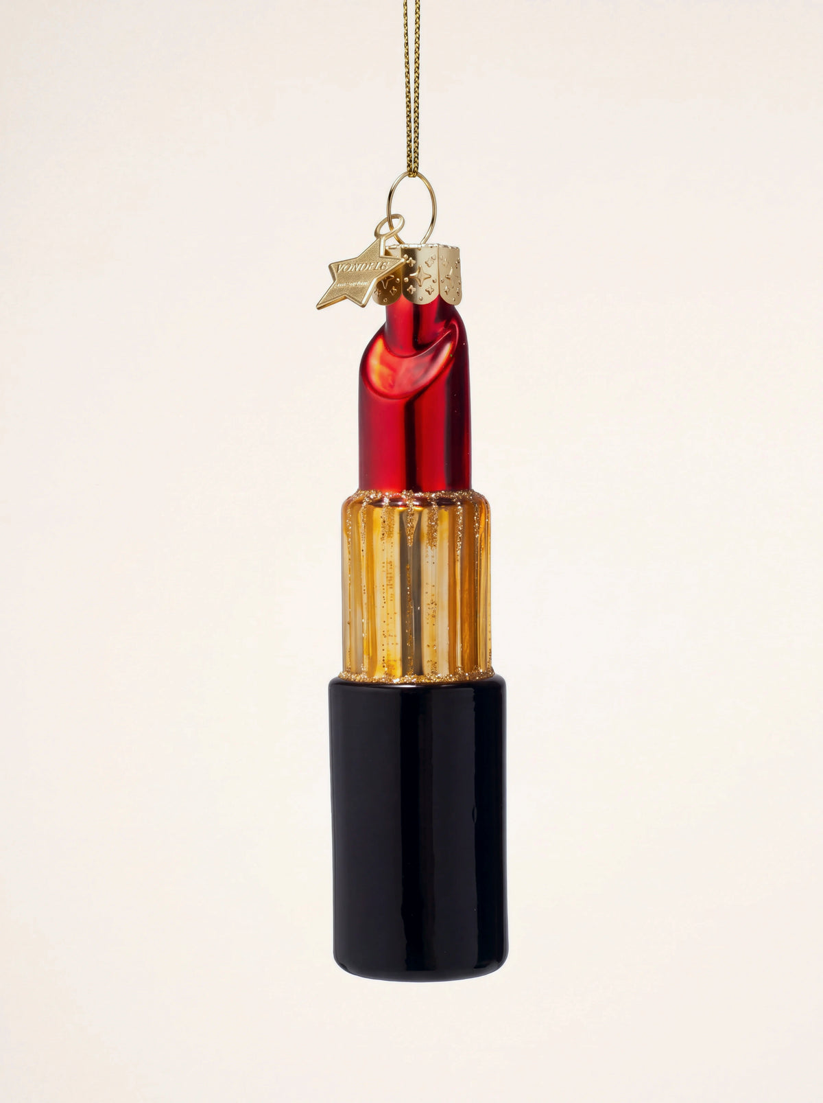 Glass lipstick ornament with a black base, ribbed gold-coloured tube and red tip