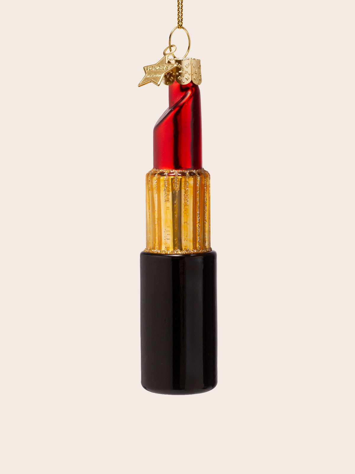 Side view of the glass lipstick ornament showing the bevelled slant of the red tip