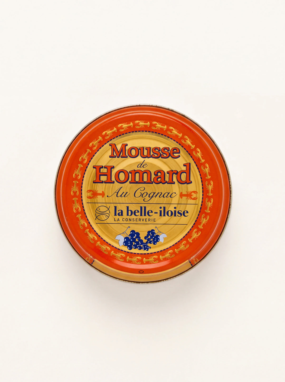 Round orange and gold tin of lobster mousse with cognac, labelled Mousse de Homard Au Cognac