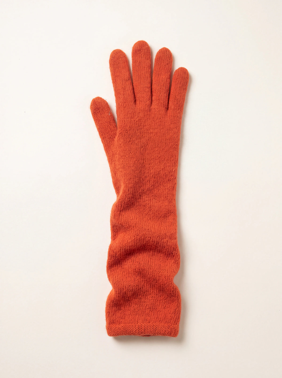 Long terracotta knitted wool and cashmere glove with an extended forearm