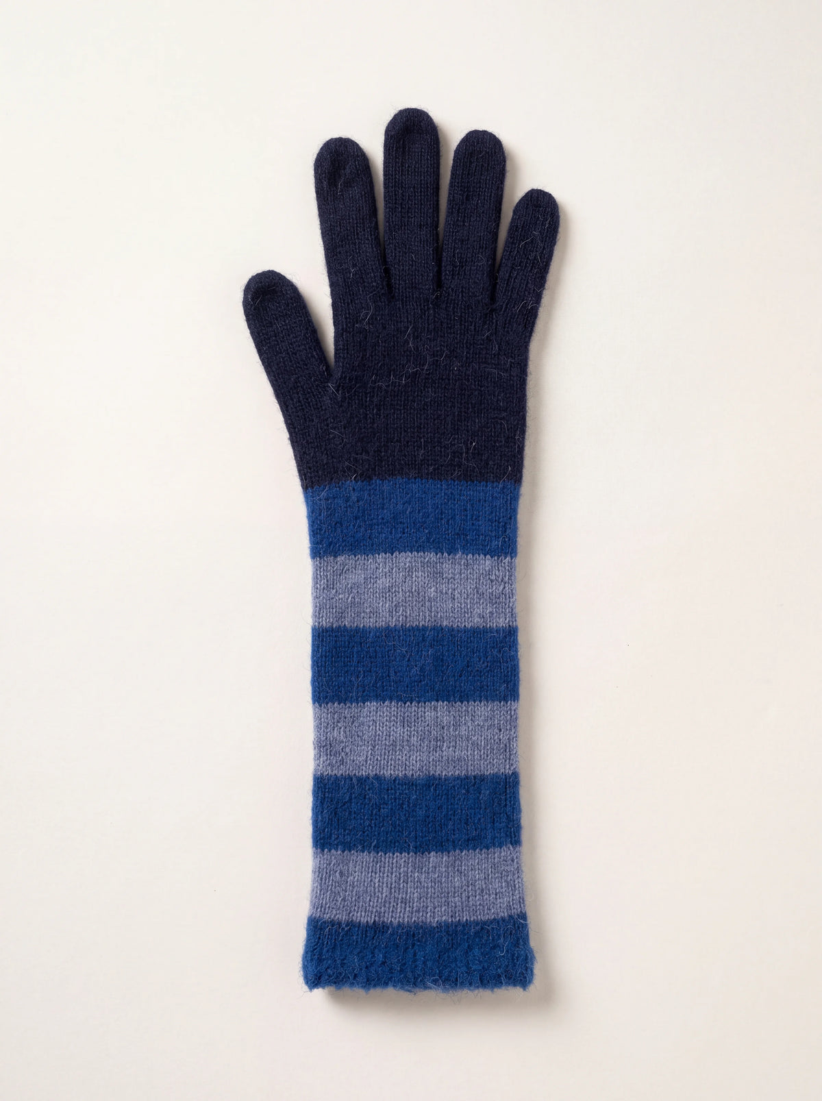 Long knitted wool and cashmere glove with a solid navy hand and alternating blue stripes along the arm