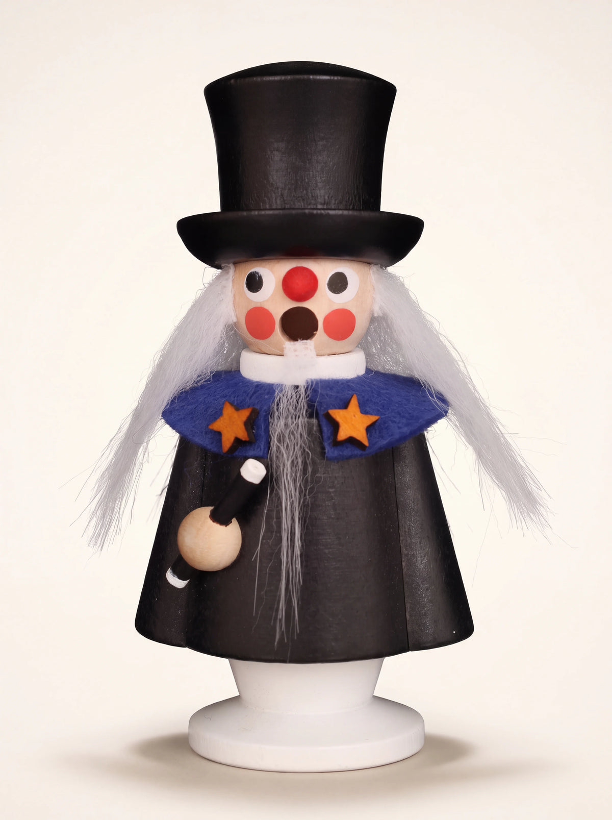 Painted wooden magician incense smoker with a black top hat, long white beard and star-accented blue cape