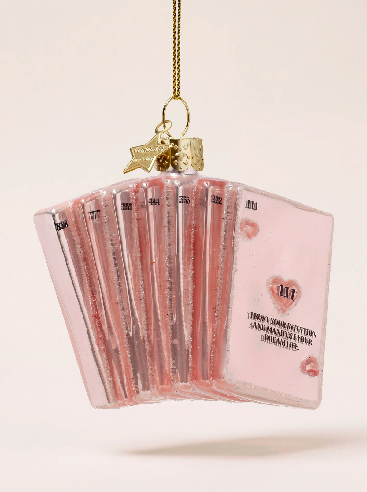Pink glass manifestation cards ornament reading 'Trust your intuition and manifest your dream life