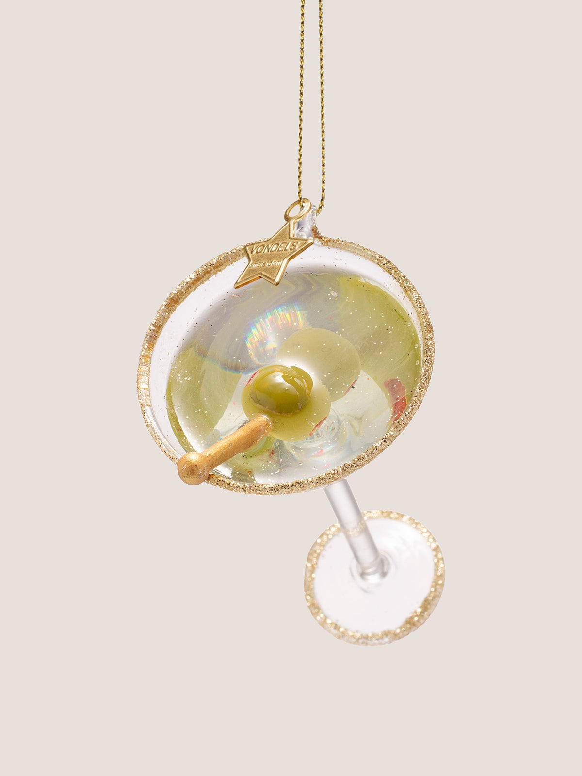 Top-down view into the martini cocktail glass ornament highlighting the round glitter rim and olive pick