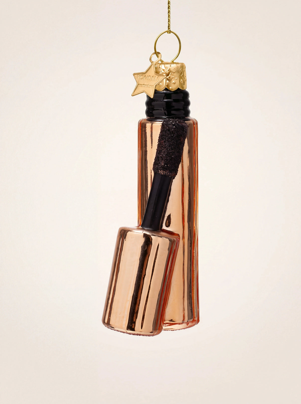 Shiny copper glass mascara ornament with attached wand, black glittered brush and gold hanging star charm