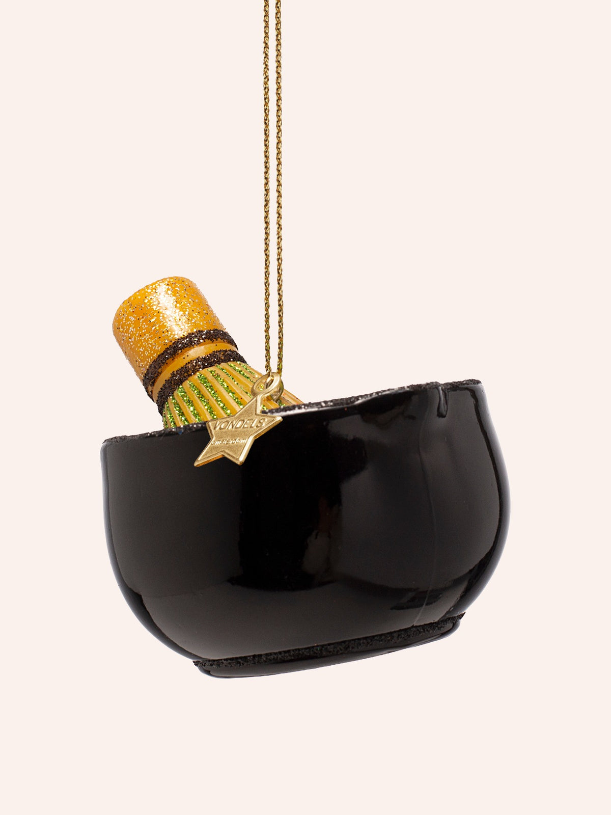 Reverse view showing the smooth, glossy black exterior of the bowl with the whisk tilted inside