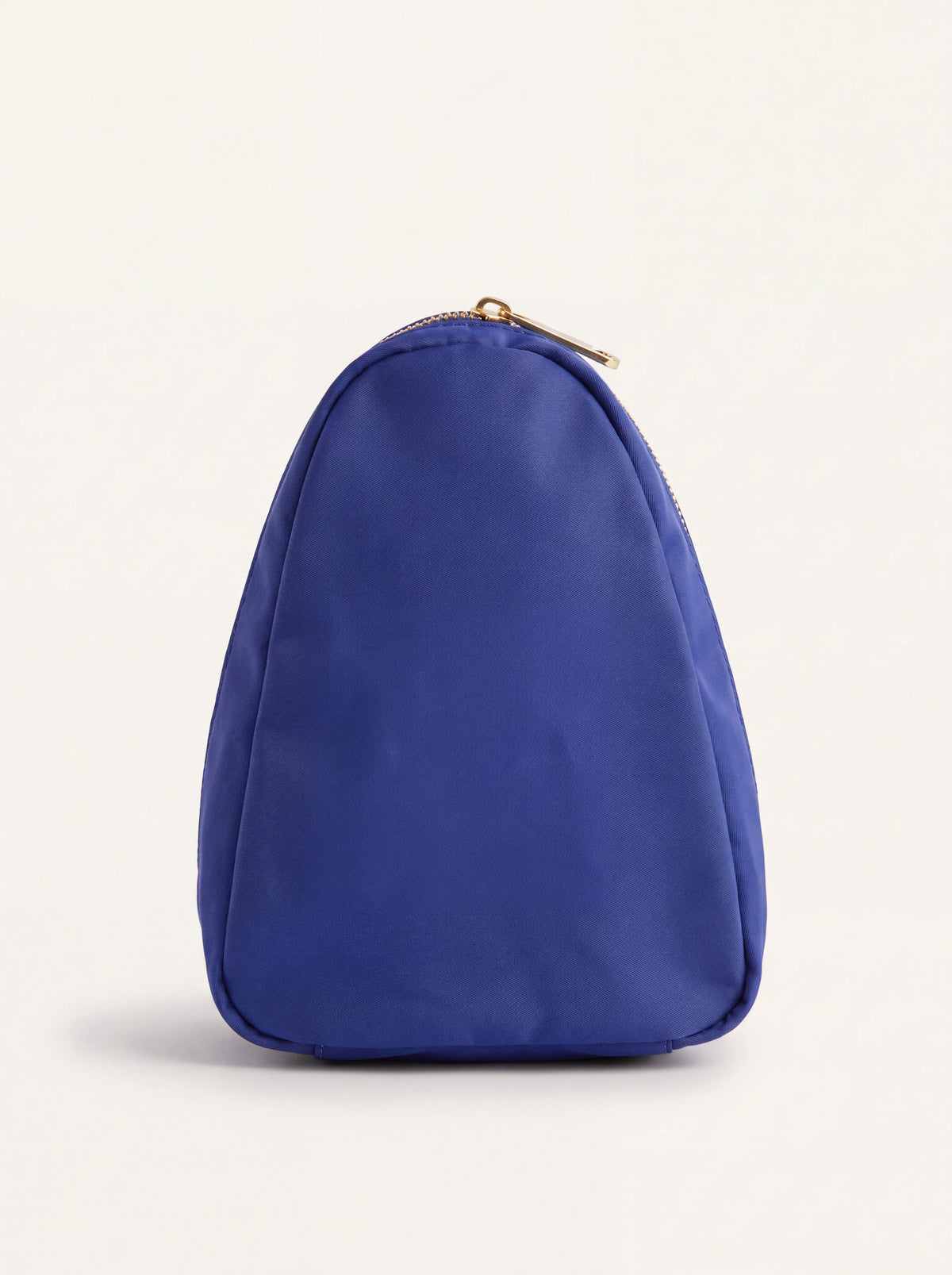 Side profile of the blue fabric pouch showing its tapered silhouette
