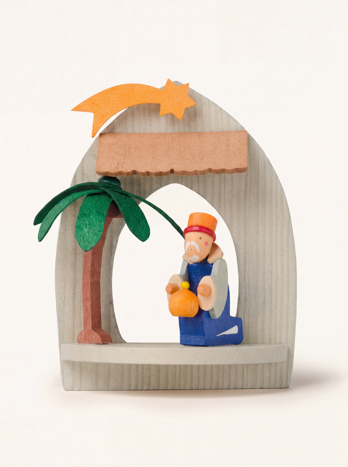 Hand-painted sycamore wood ornament with an arched frame, kneeling Melchior figure, palm tree and orange star