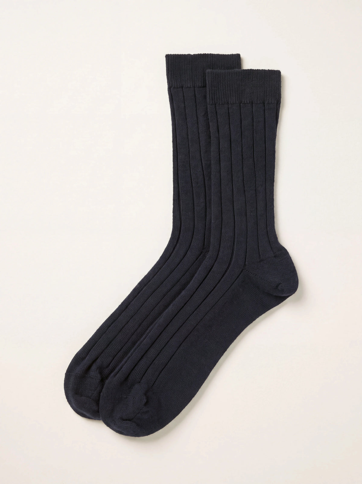 Dark navy cashmere ribbed socks with fine-ribbed cuffs, shown as a pair
