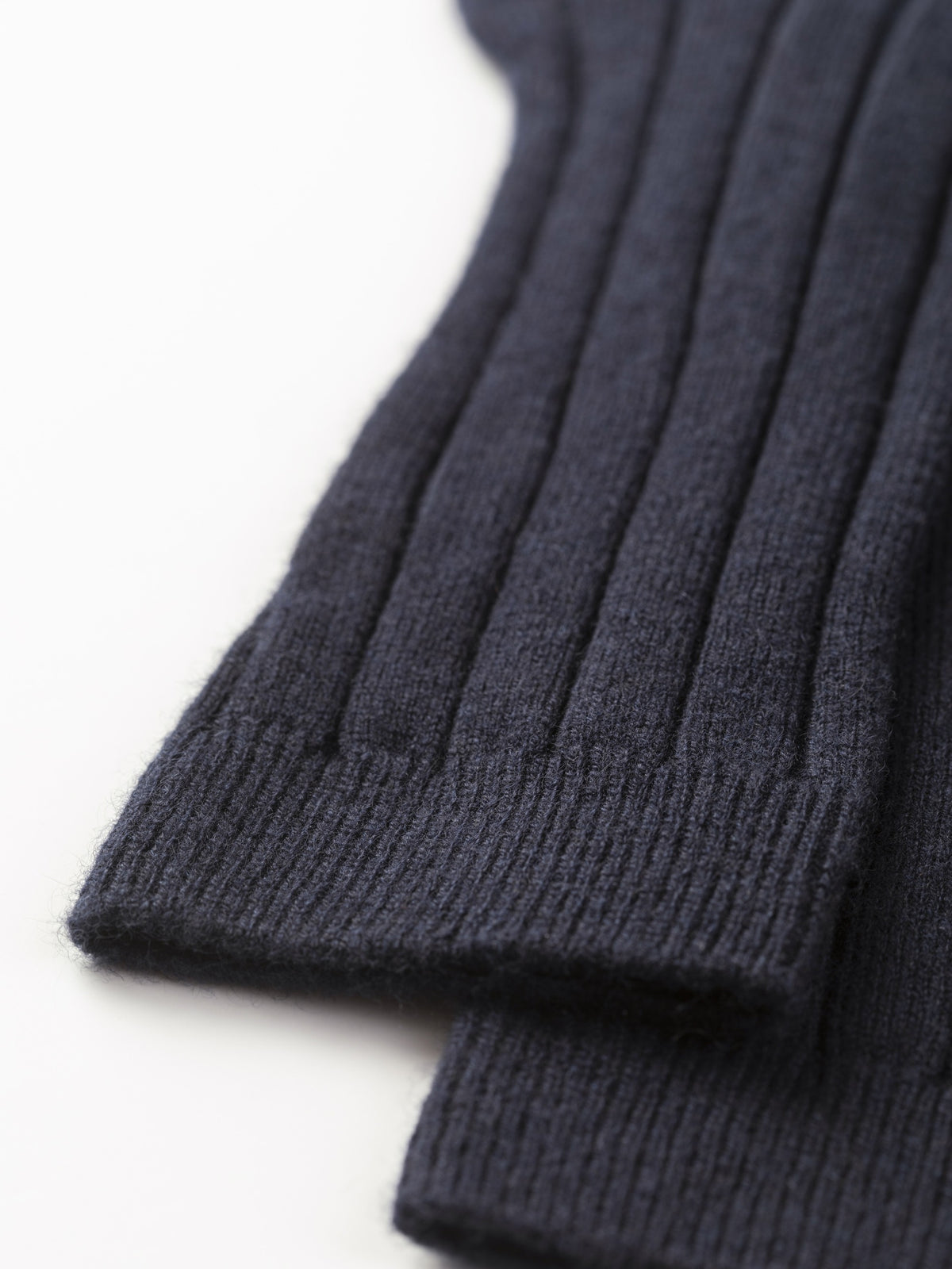 Close-up of the cuffs showing the fine ribbing and soft cashmere knit texture