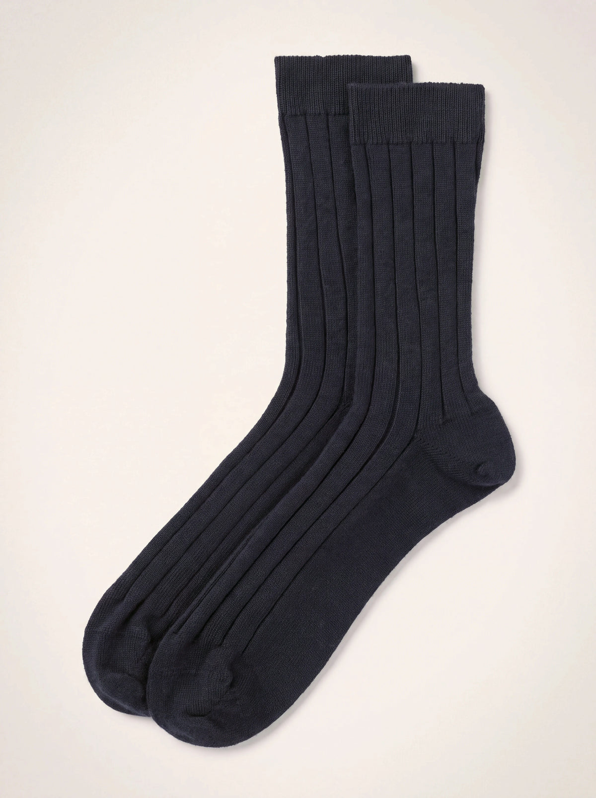 Dark navy ribbed cashmere socks laid flat, showing the ribbed leg, heel and toe
