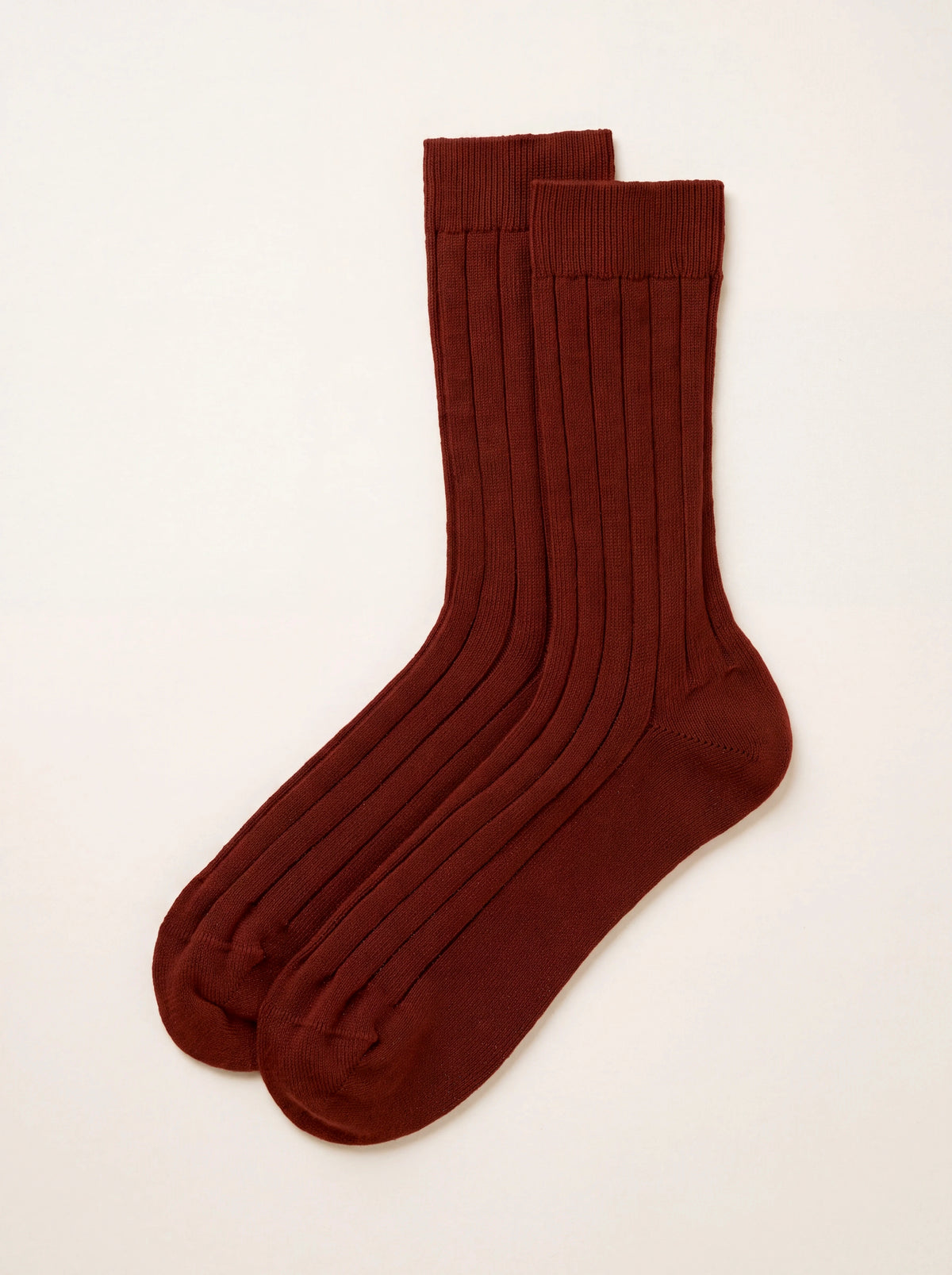 Oxblood ribbed cashmere socks laid flat, showing the ribbed knit and smooth heel and toe