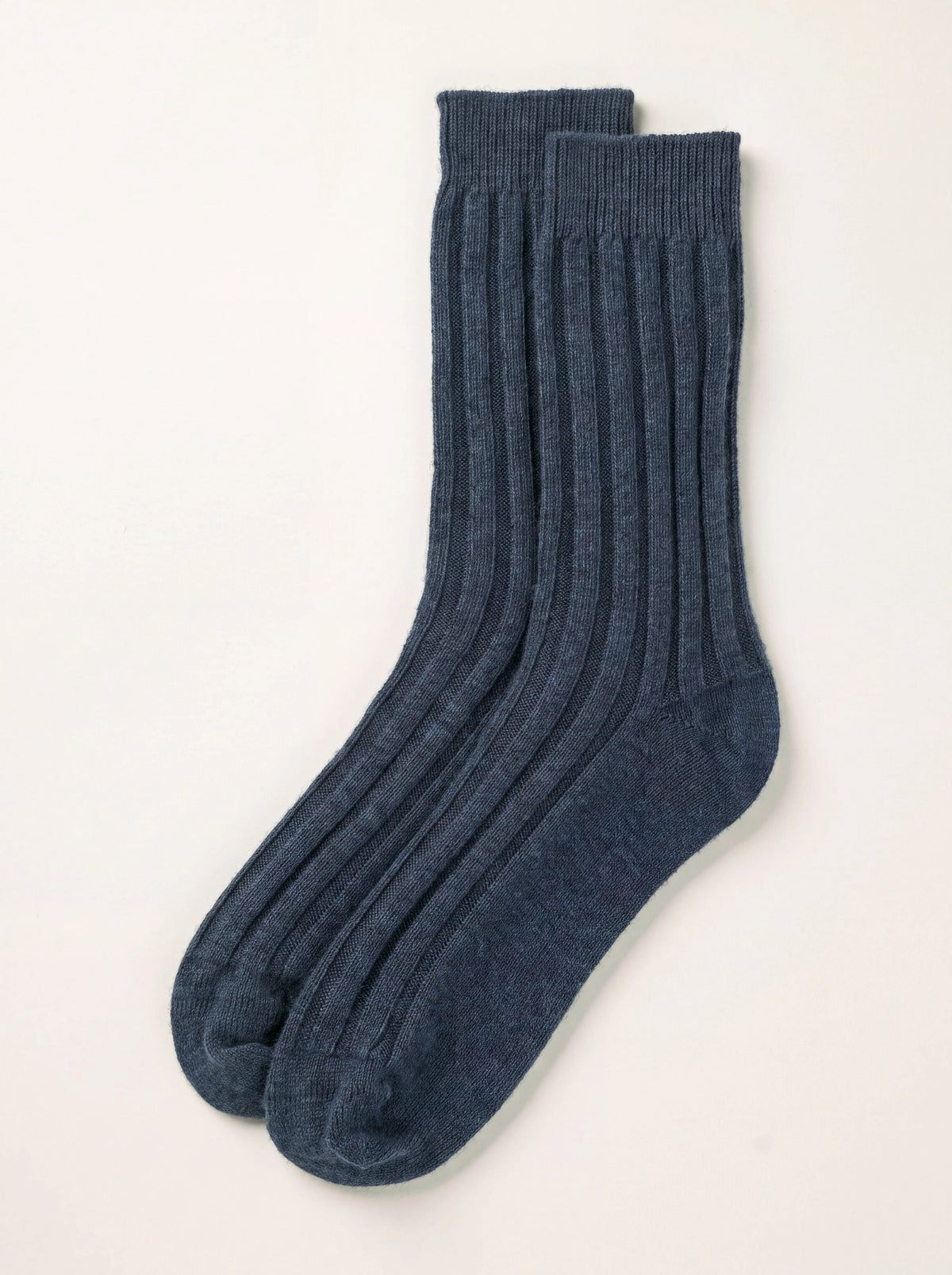 Pair of heather navy ribbed cashmere travel socks with smooth heels and toes