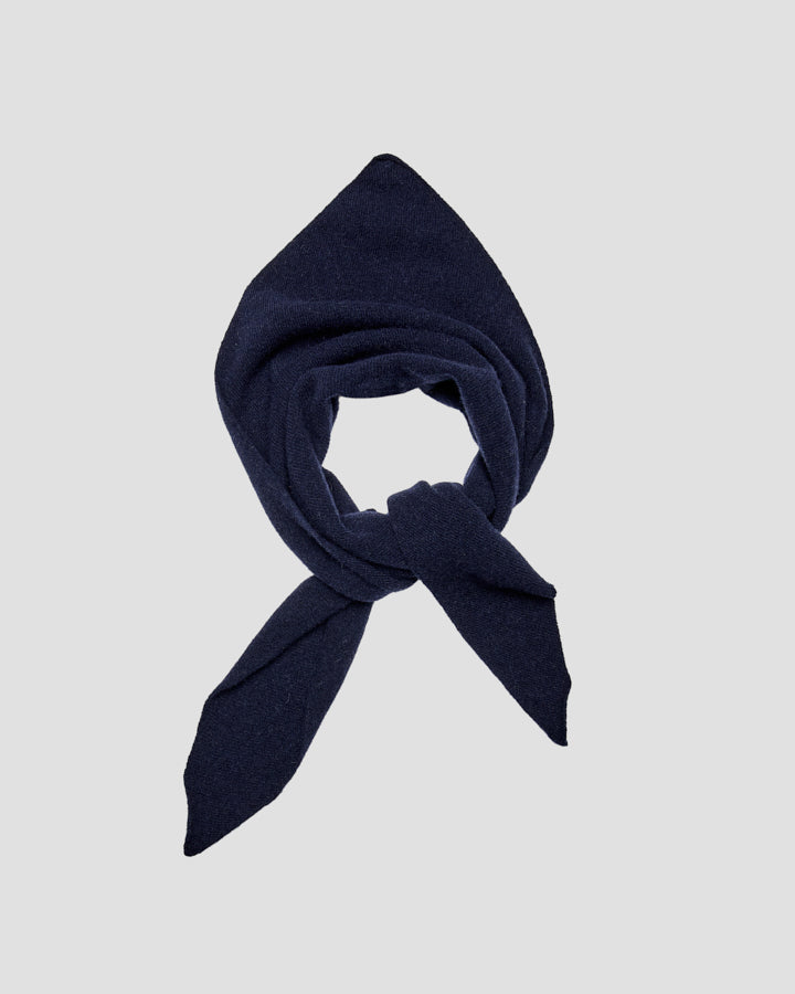 Navy blue merino wool bandana loosely tied into a neck loop with pointed tapered ends