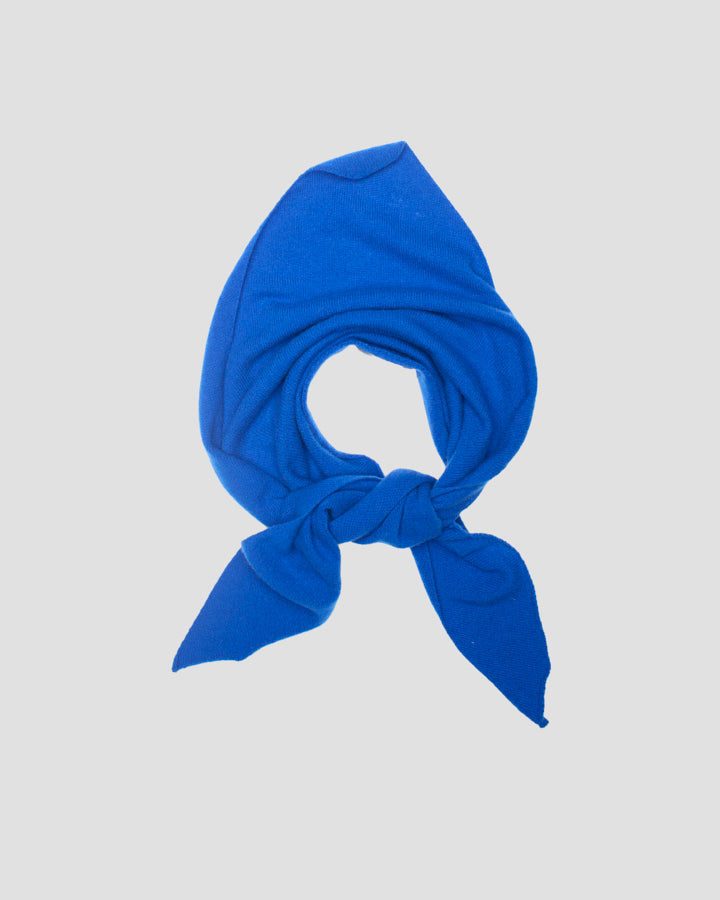 Royal blue merino wool bandana tied in a loop with tapered ends
