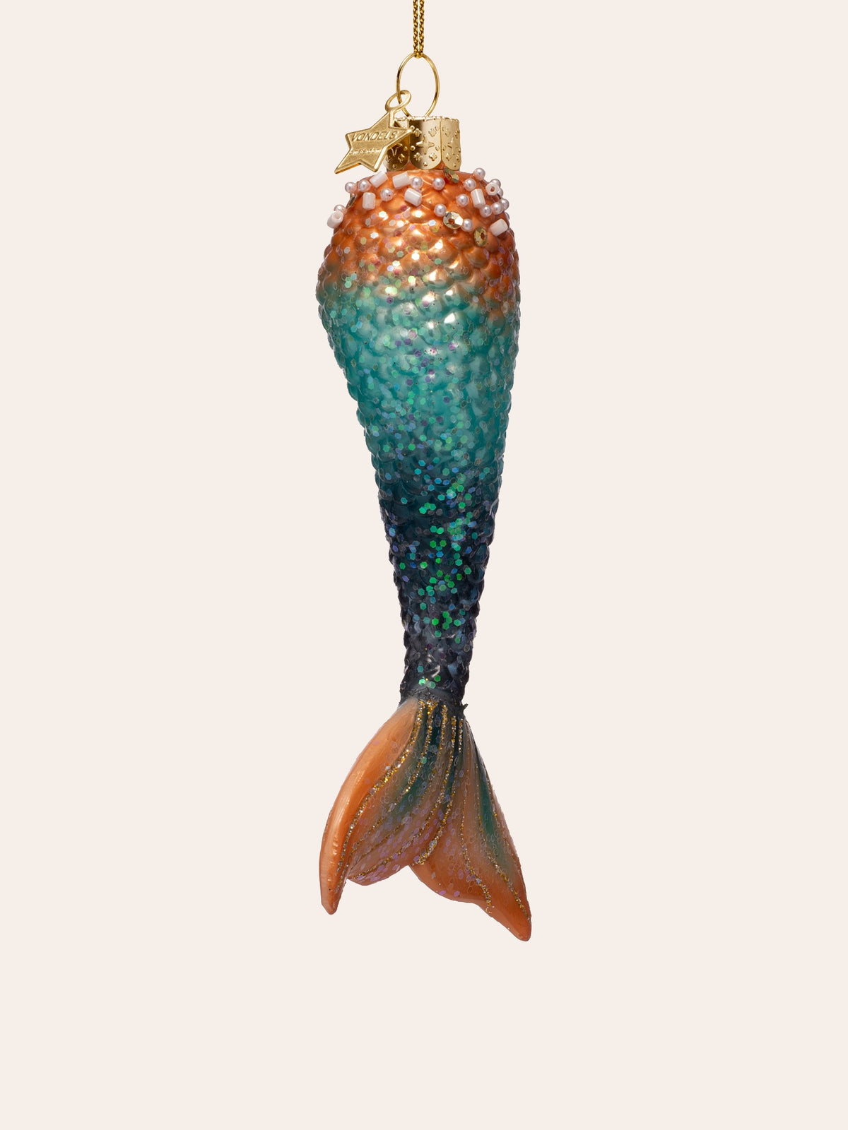 Three-quarter view of the mermaid tail ornament, showing the tapered fin and beaded rim