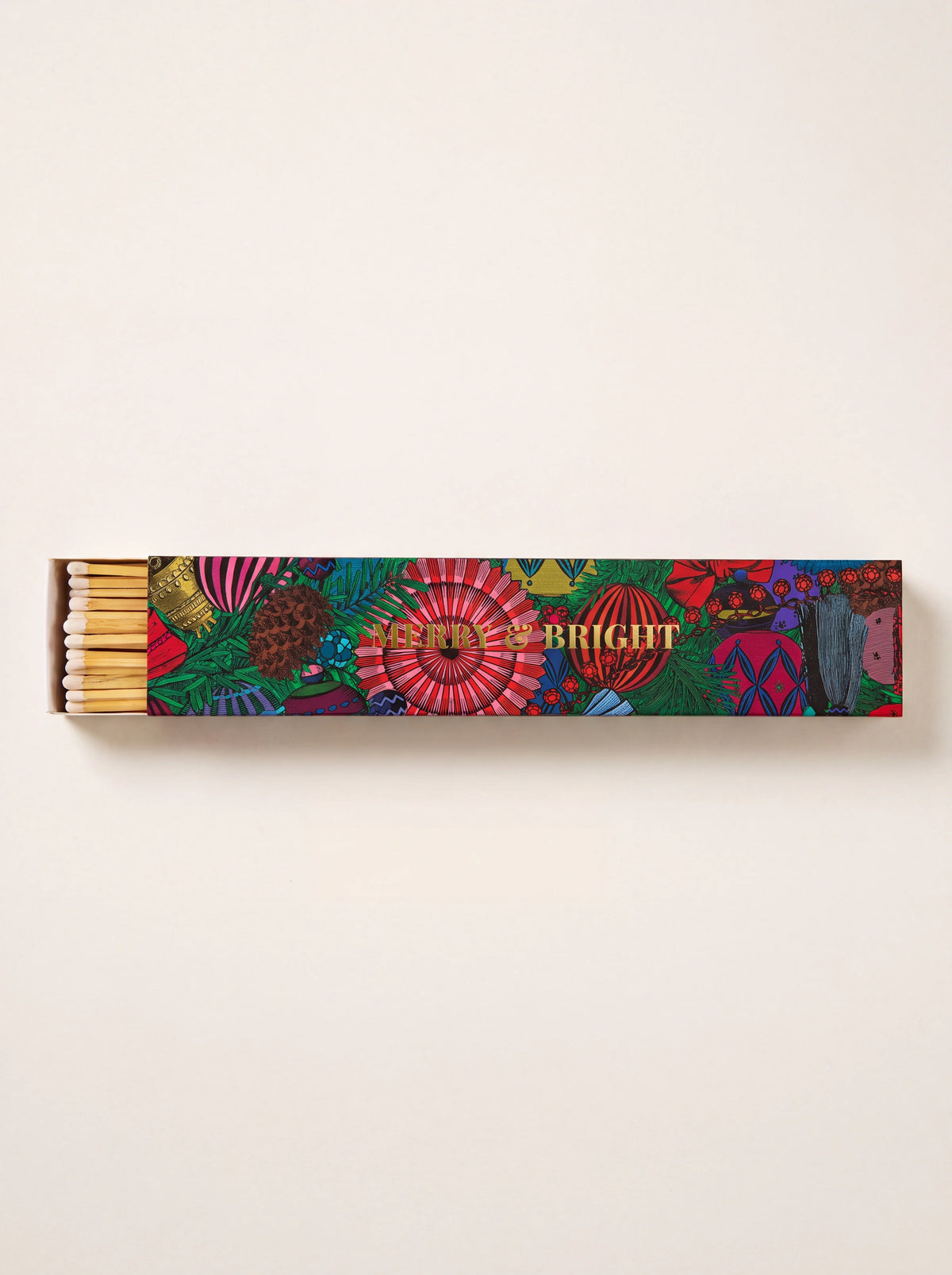 Long matchbox with colourful bauble pattern and gold text MERRY & BRIGHT, slid open to show matches