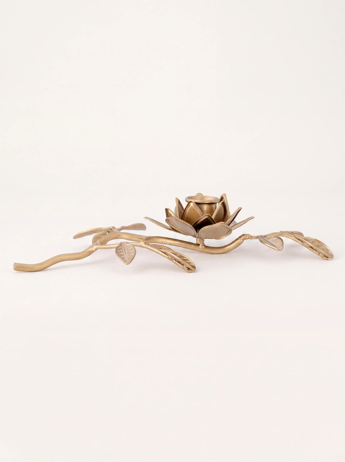 Gold iron candle holder shaped as a flowering branch with a central blossom cup