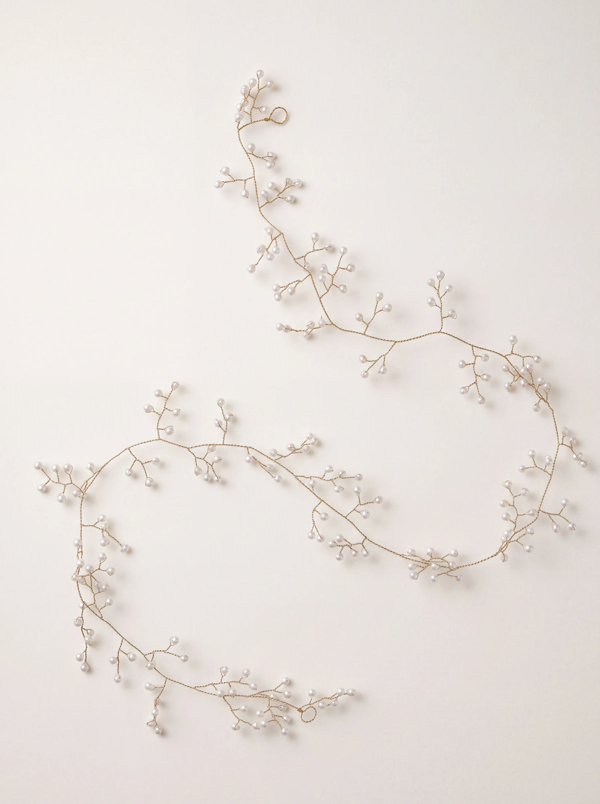 Flexible gold wire garland with branching stems of white pearl beads and looped ends