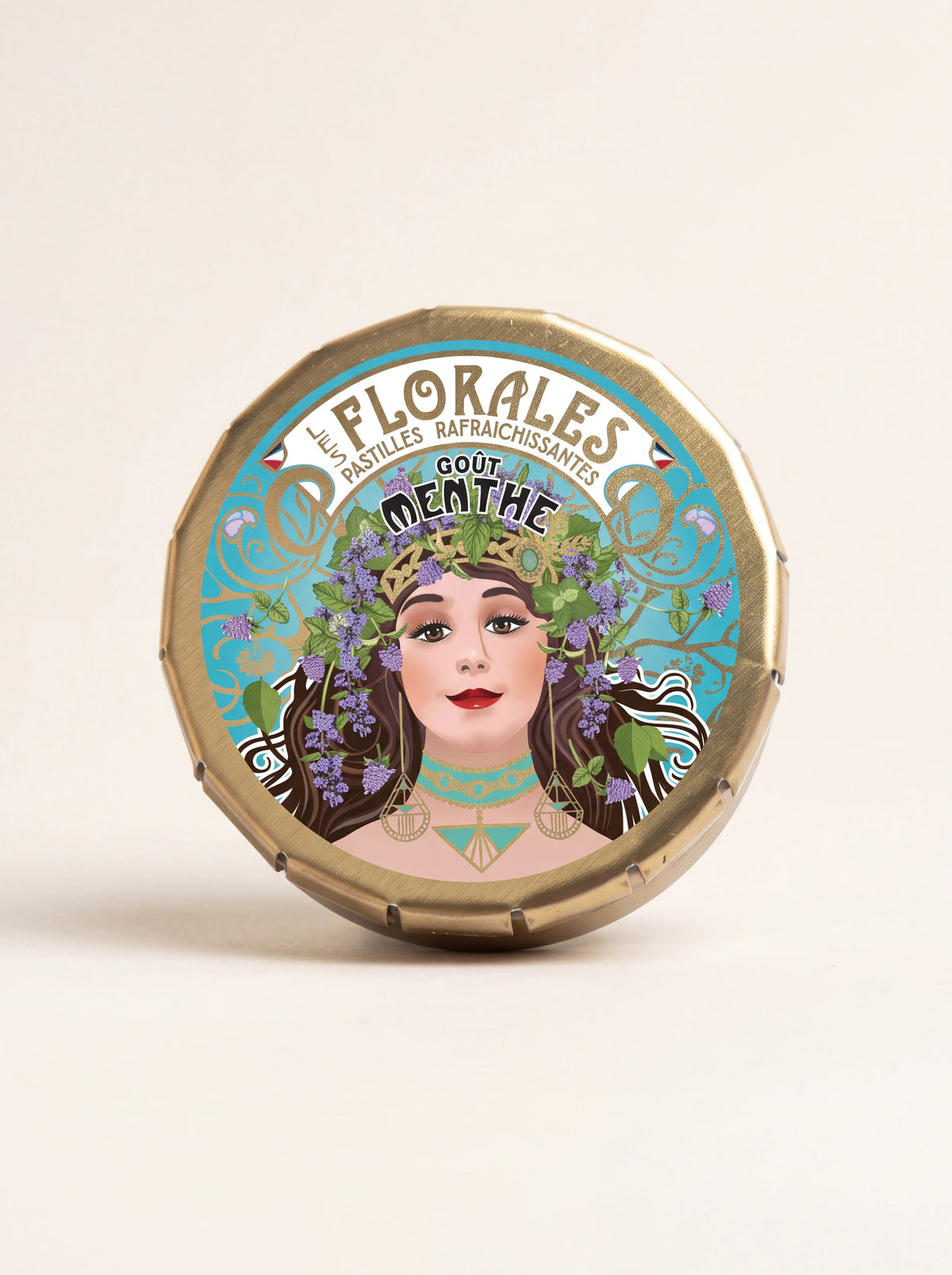 Round metal tin of mint pastilles with Art Nouveau illustration and text reading Les Florales pastilles goût menthe