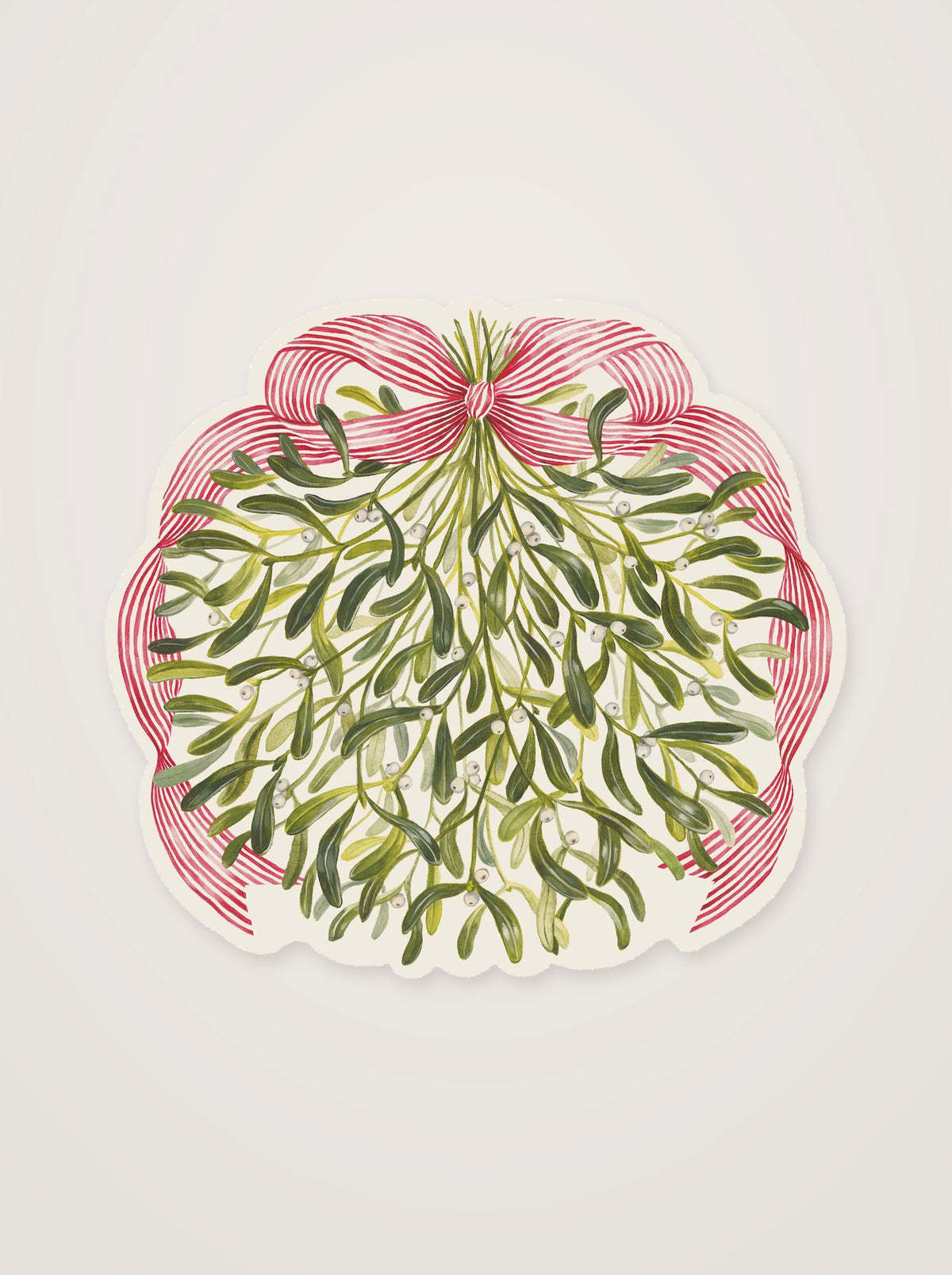Mistletoe paper placemat cut to a scalloped outline, featuring hanging green sprigs and a red-and-white bow