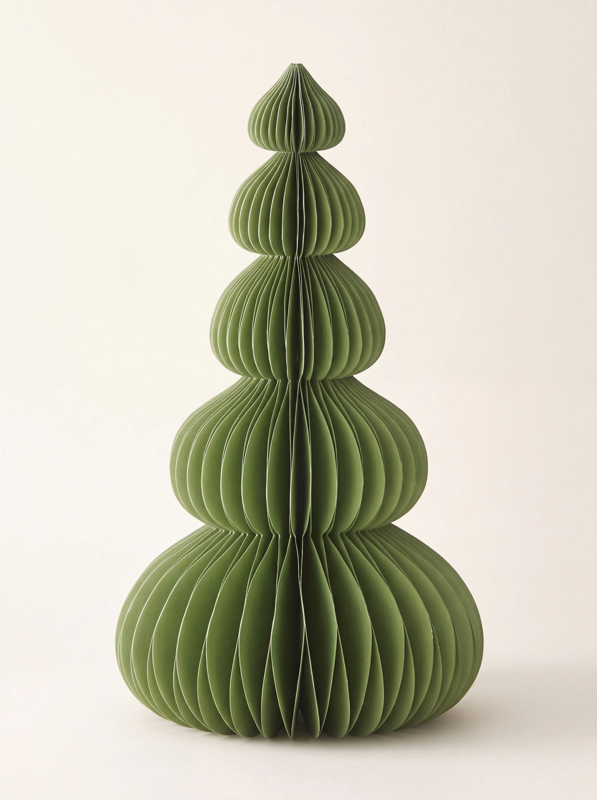 Forest green paper tree with five rounded tiers in a honeycomb design