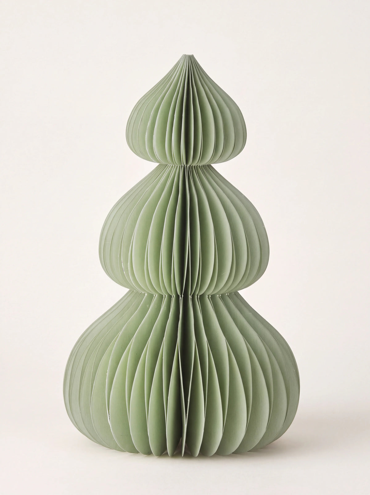 Sage green paper honeycomb tree with three rounded tiers tapering to a pointed tip