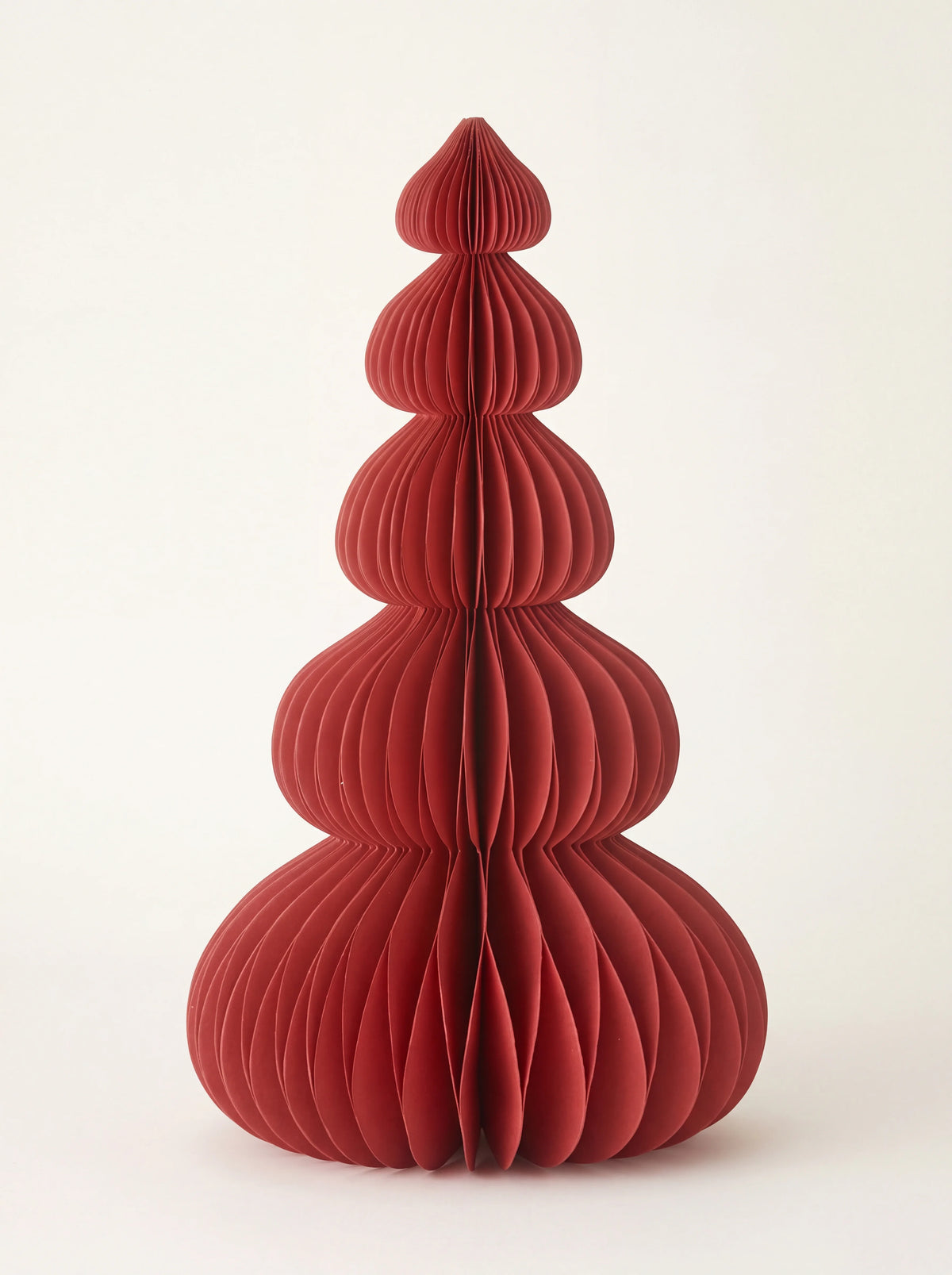 Ruby red paper tree with a five-tiered honeycomb structure tapering to a point
