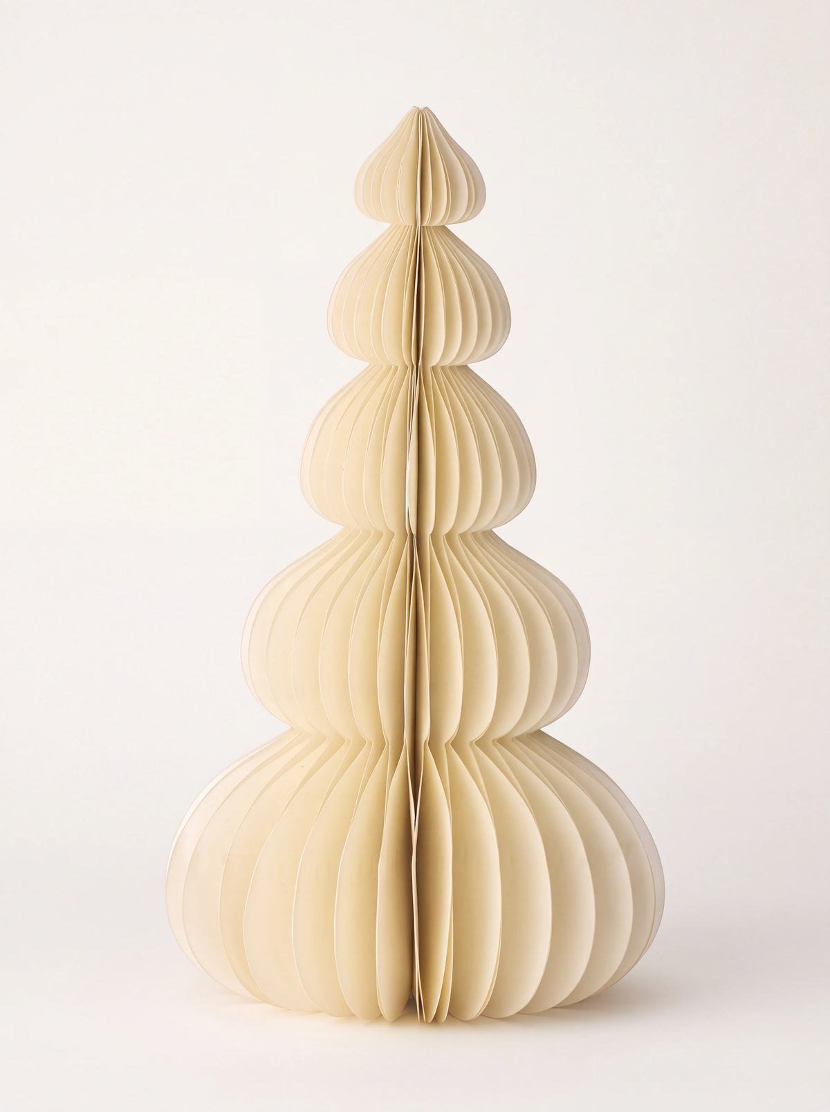 Cream honeycomb paper tree decoration with five rounded tiers