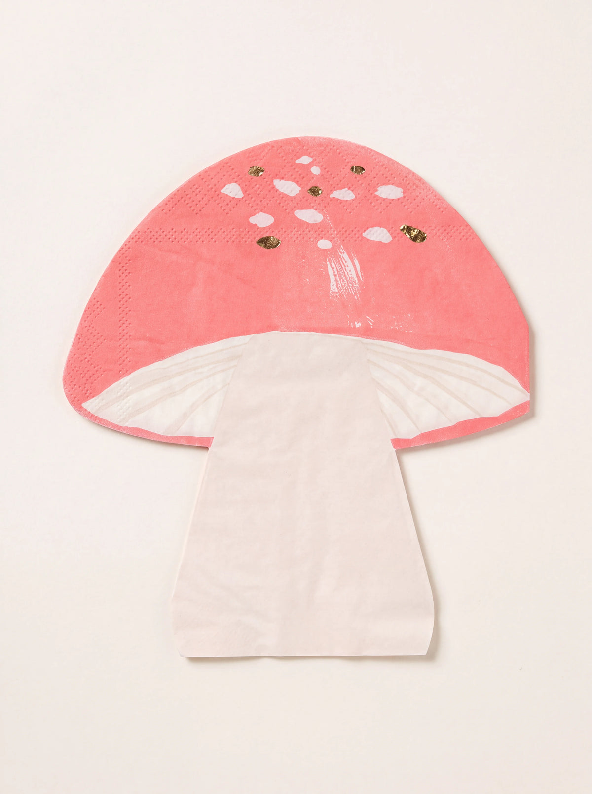 Mushroom-shaped paper napkin with a coral red cap, white spots, gold foil details, and a pale stem