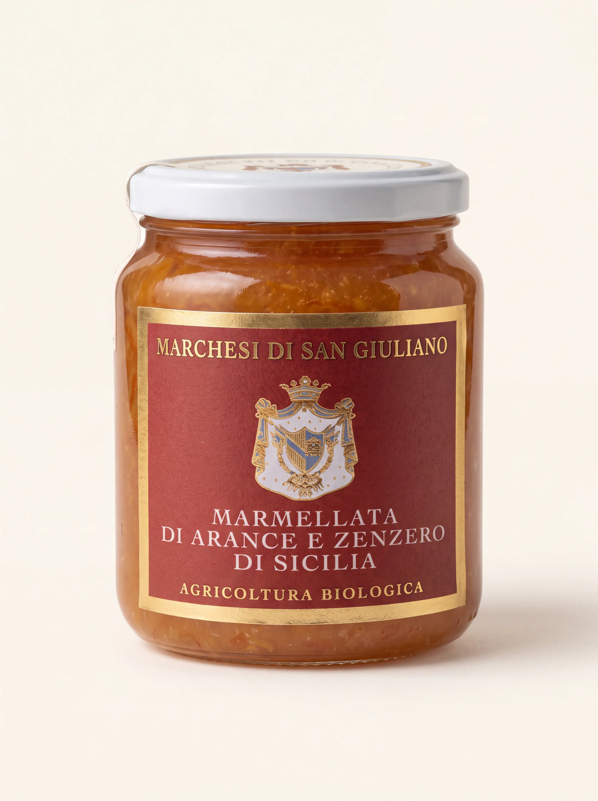 Orange and ginger marmalade in a glass jar with a white lid, labelled Marmellata di Arance e Zenzero