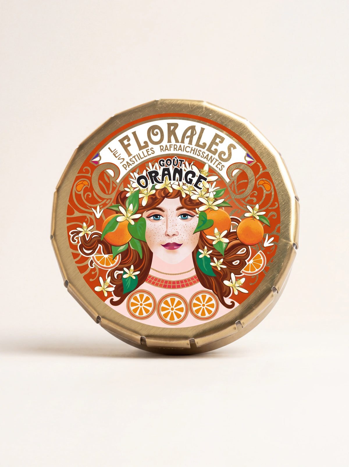 Round gold-coloured tin with Art Nouveau portrait and text Les Florales Pastilles Rafraîchissantes Goût Orange